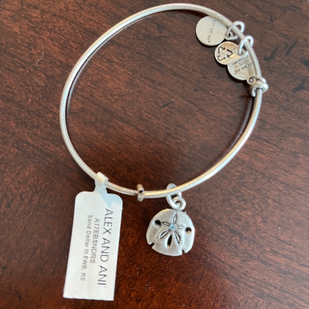 Alex and Ani Sand Dollar bangle bracelet with blue Swarovski crystal